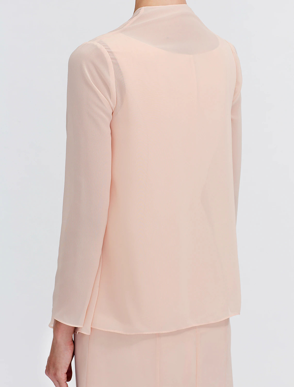 Weitese two-piece dress showing the back detail and flowing tea-length skirt.