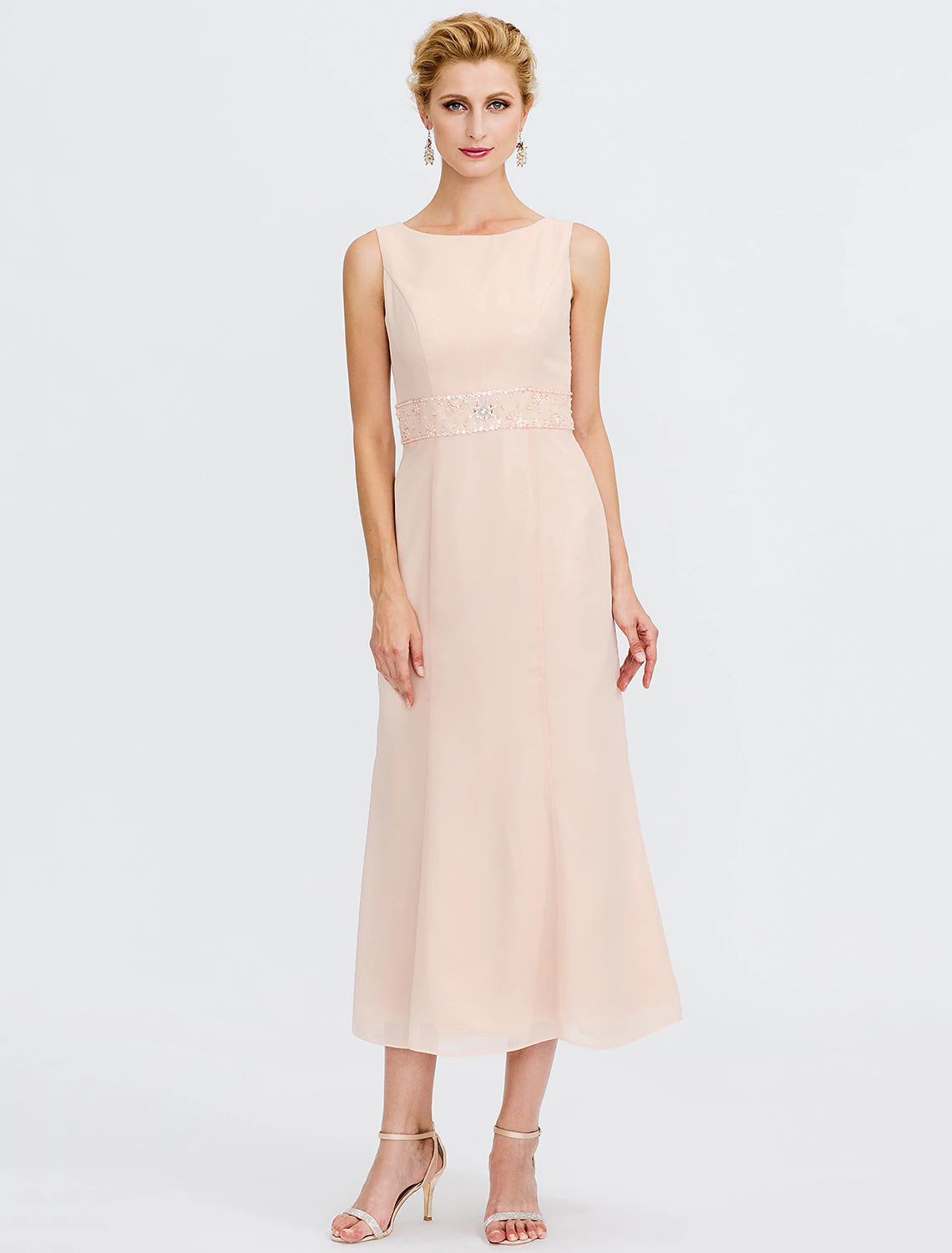 Model showcasing the elegant two-piece mother of the bride dress with jacket.