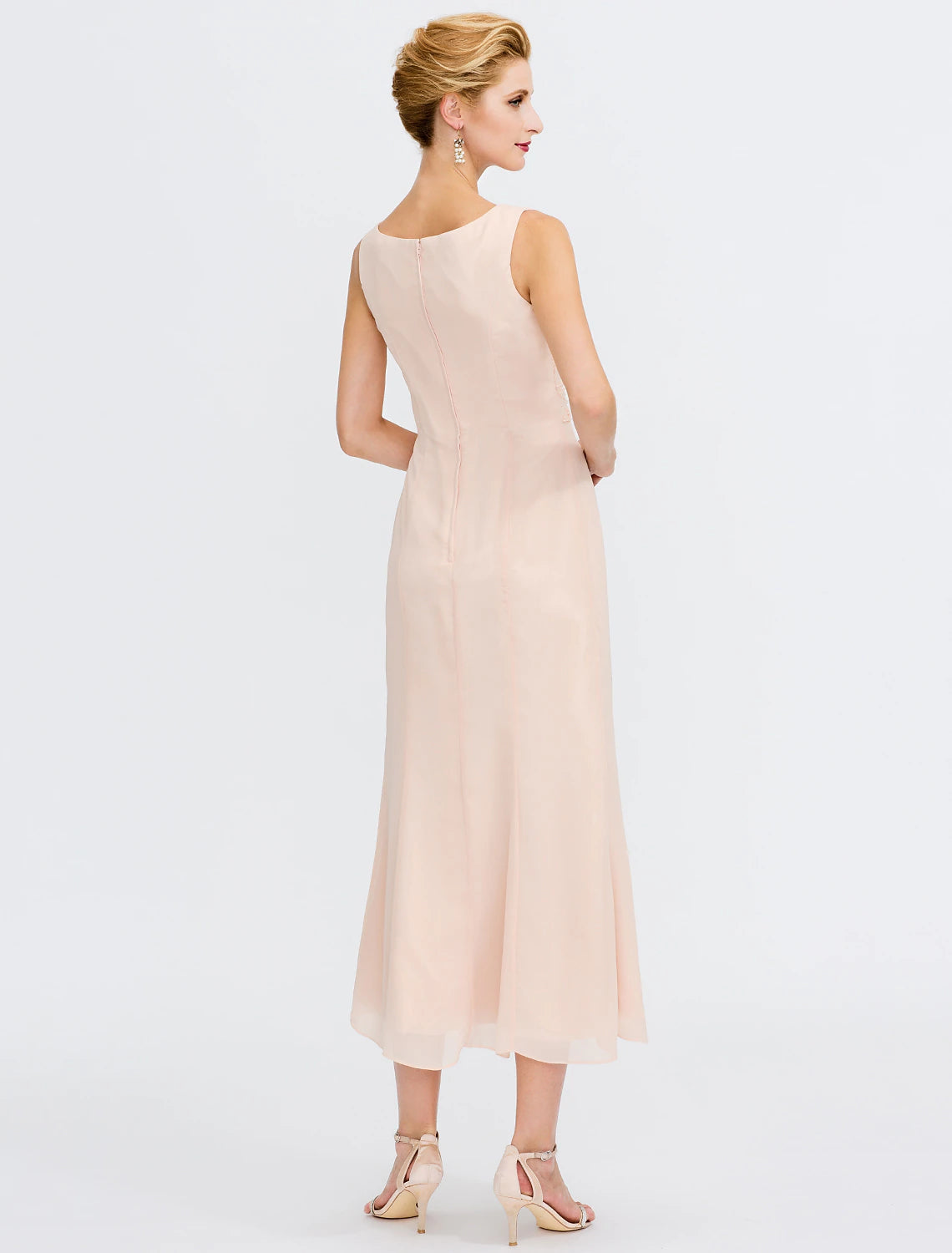 Side view of the two-piece sheath dress, highlighting the jacket and tea-length hem.