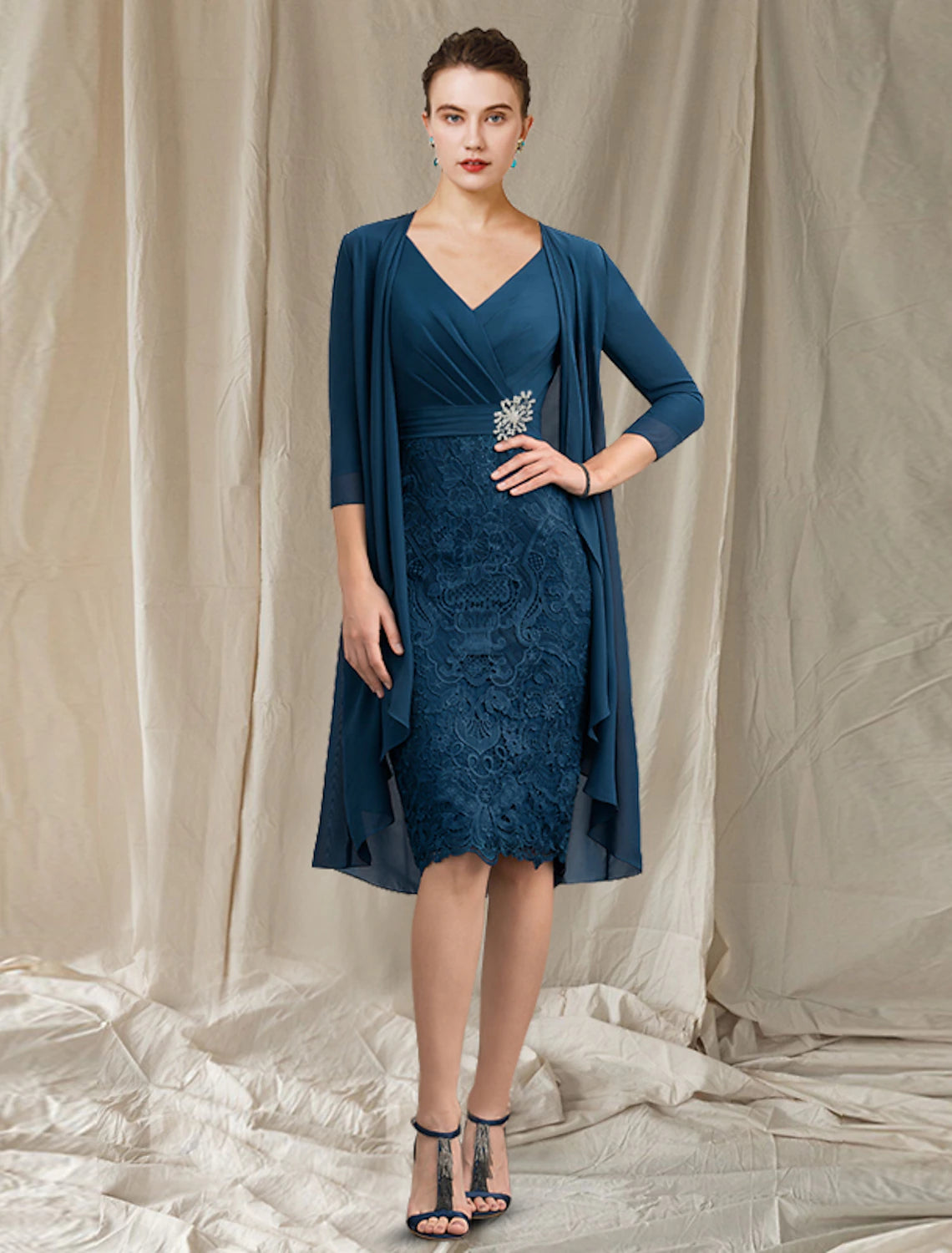Back view of the elegant two-piece sheath dress with a jacket.
