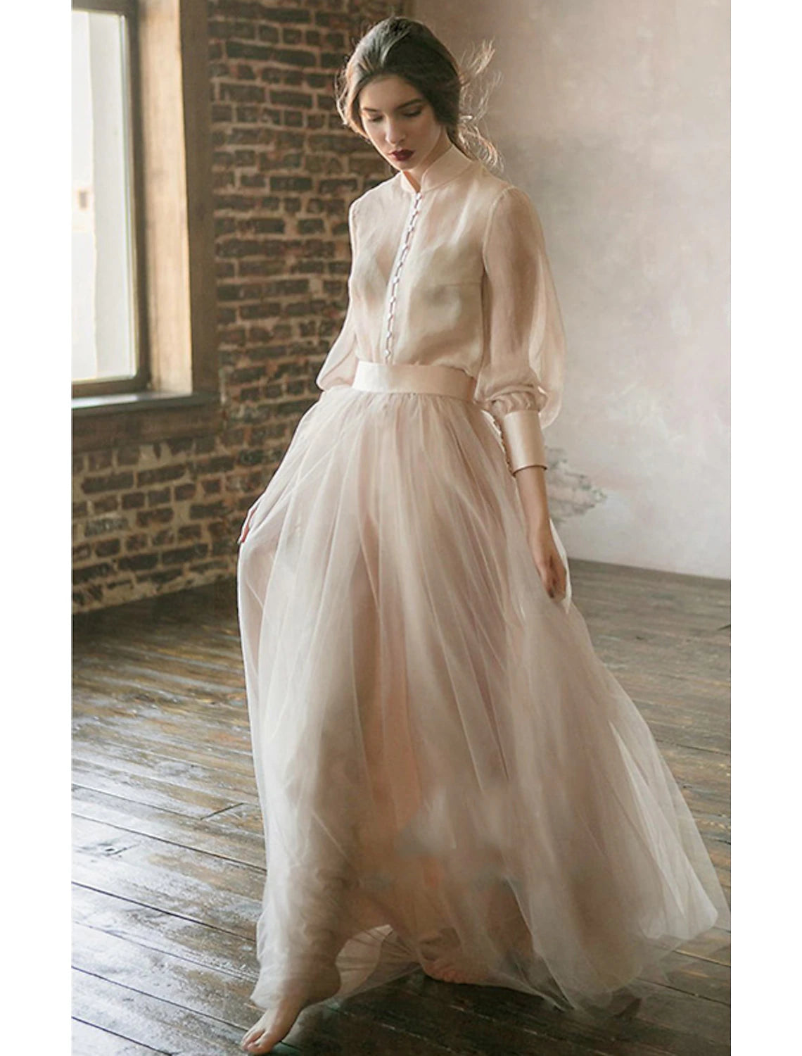 Back view of the elegant two-piece formal dress with tiered design.