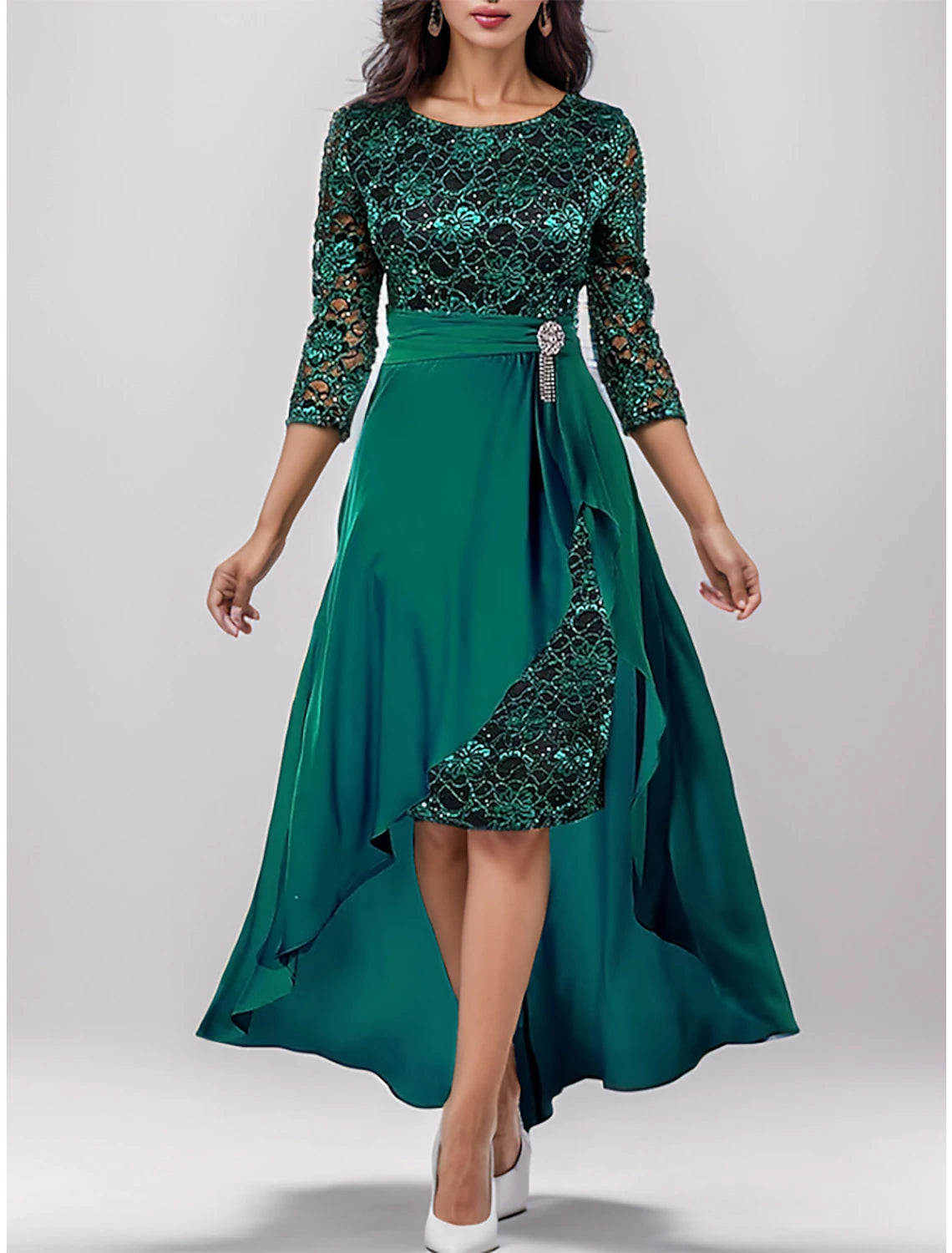 Woman wearing an elegant green two-piece lace maxi dress with V-neck and 3/4 sleeves.
