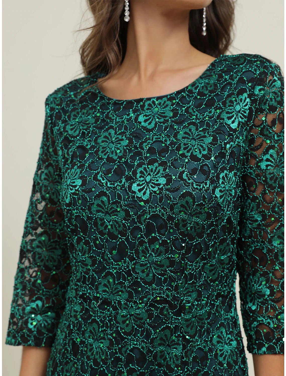 Close-up of the intricate green lace detail on the Weitese maxi dress.