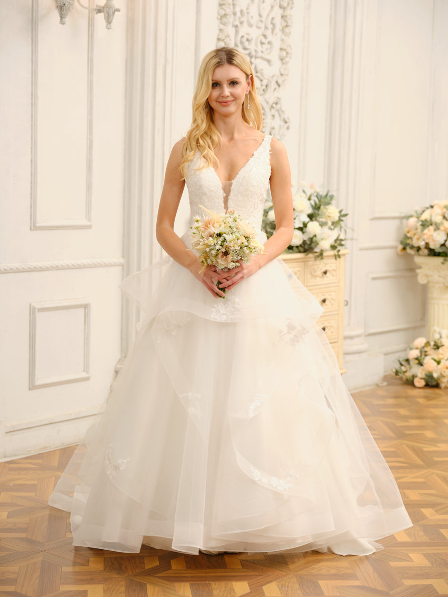 Back view of the Weitese V-neck wedding dress with a flowing ball gown skirt.