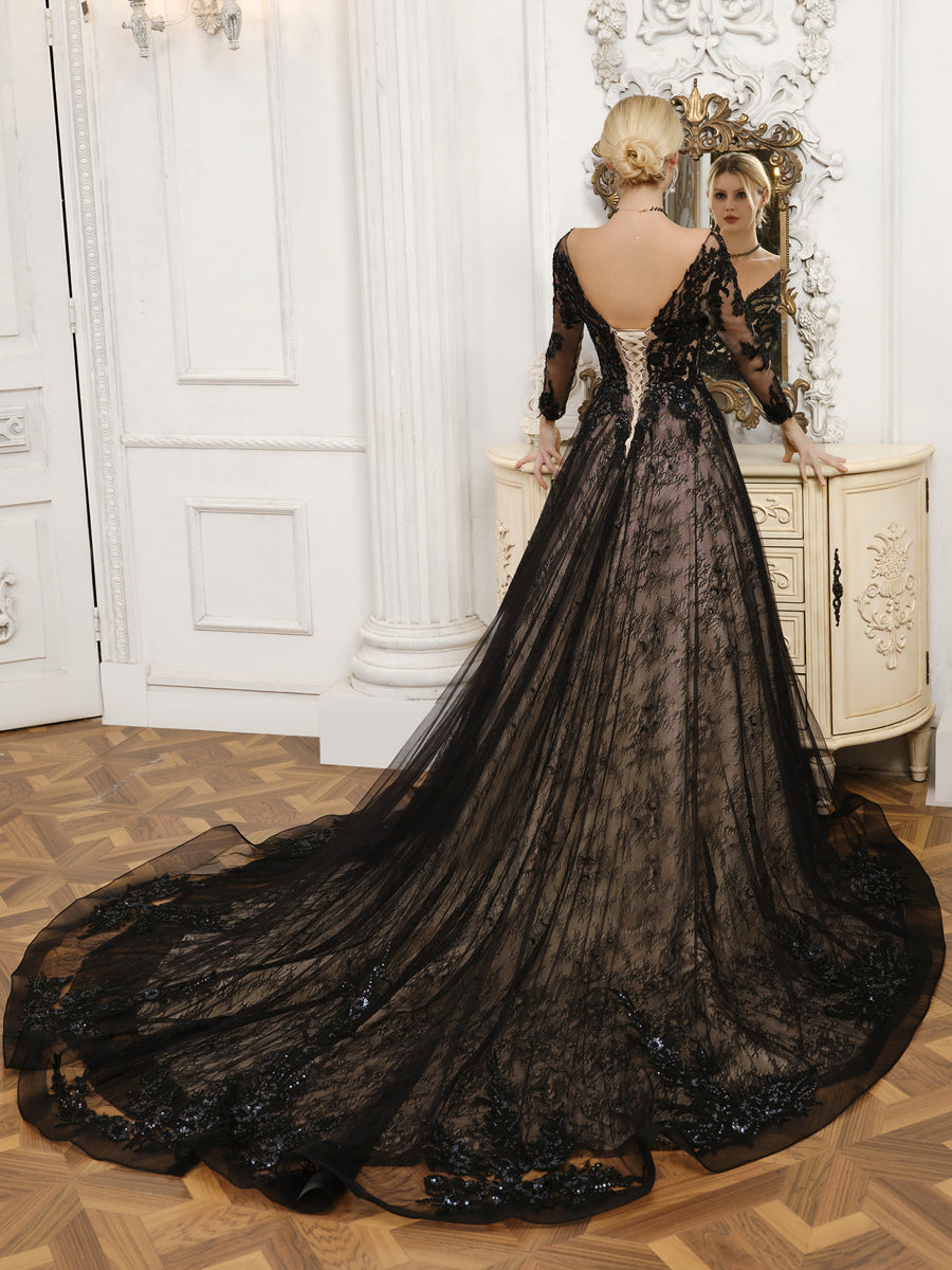 Side view of the V-neck long sleeve beaded tulle wedding dress with a flowing train.