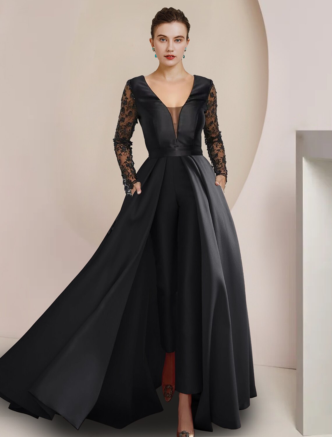 Woman wearing an elegant V-neck long sleeve satin lace dress.