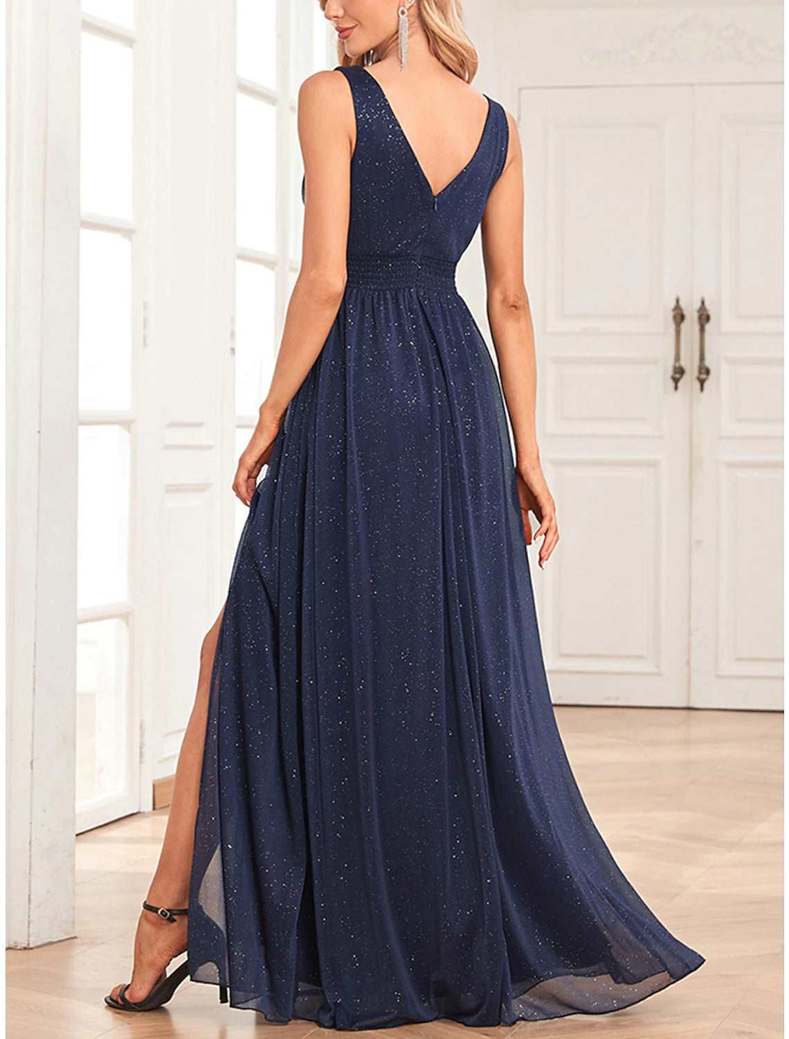 Model wearing a dark blue V-neck short sleeve maxi dress, front view.