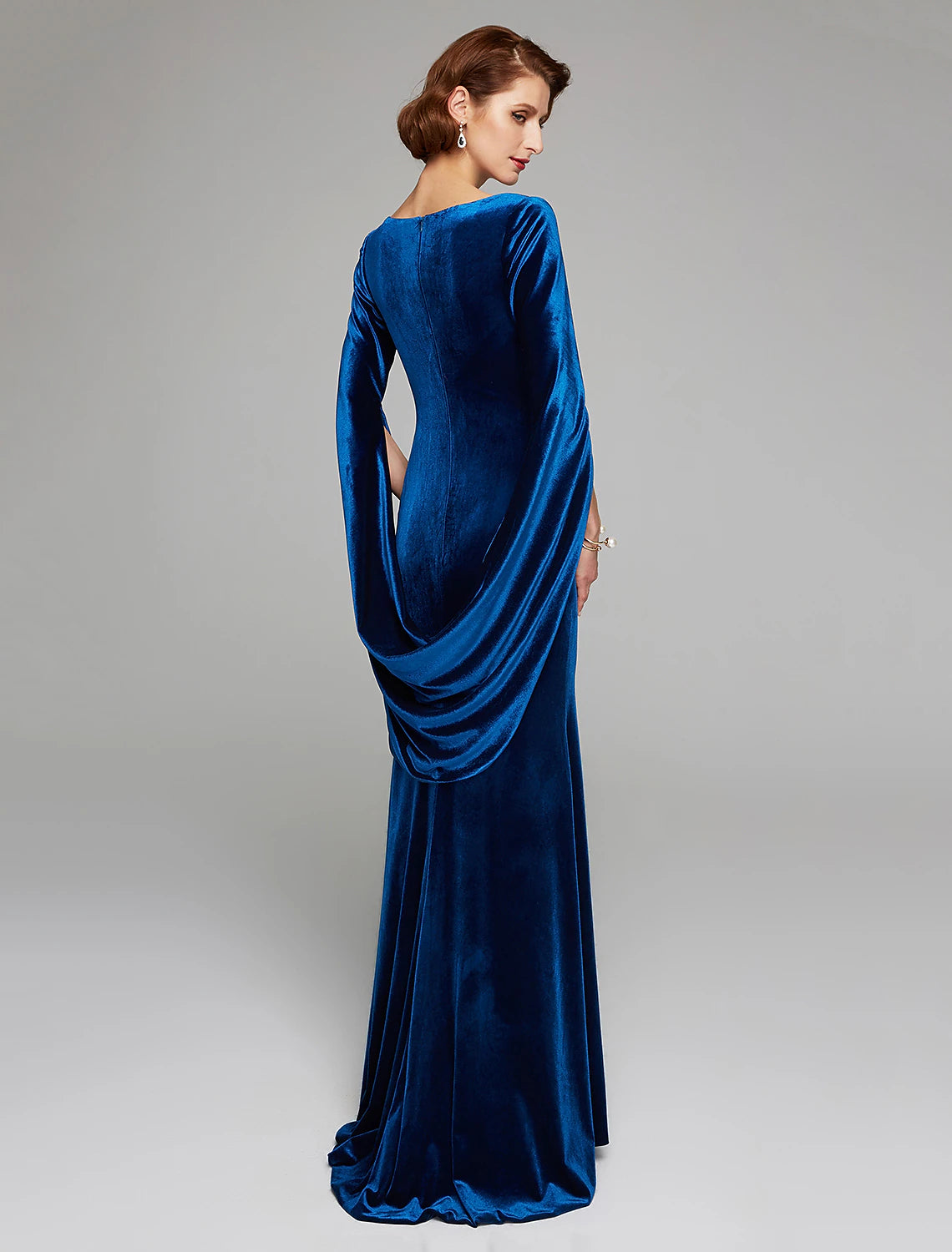 Side view of the velvet mermaid dress, highlighting the sweep train and fitted silhouette.