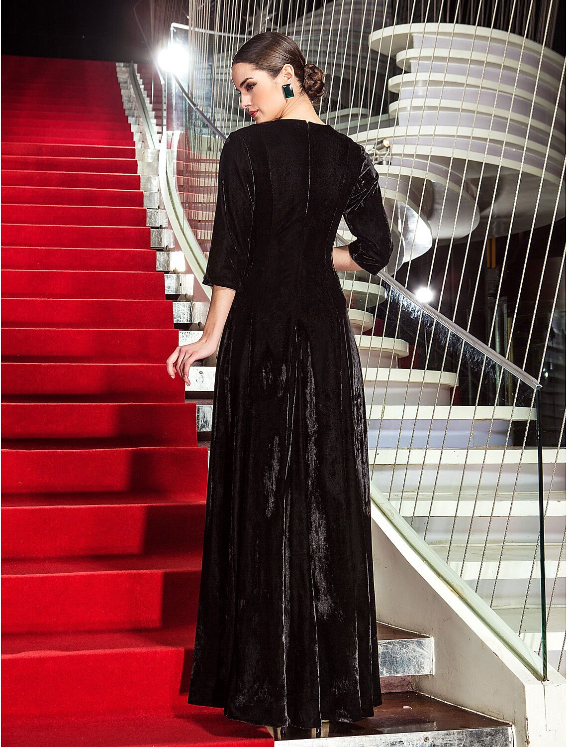 Back view of the A-line black velvet formal dress.