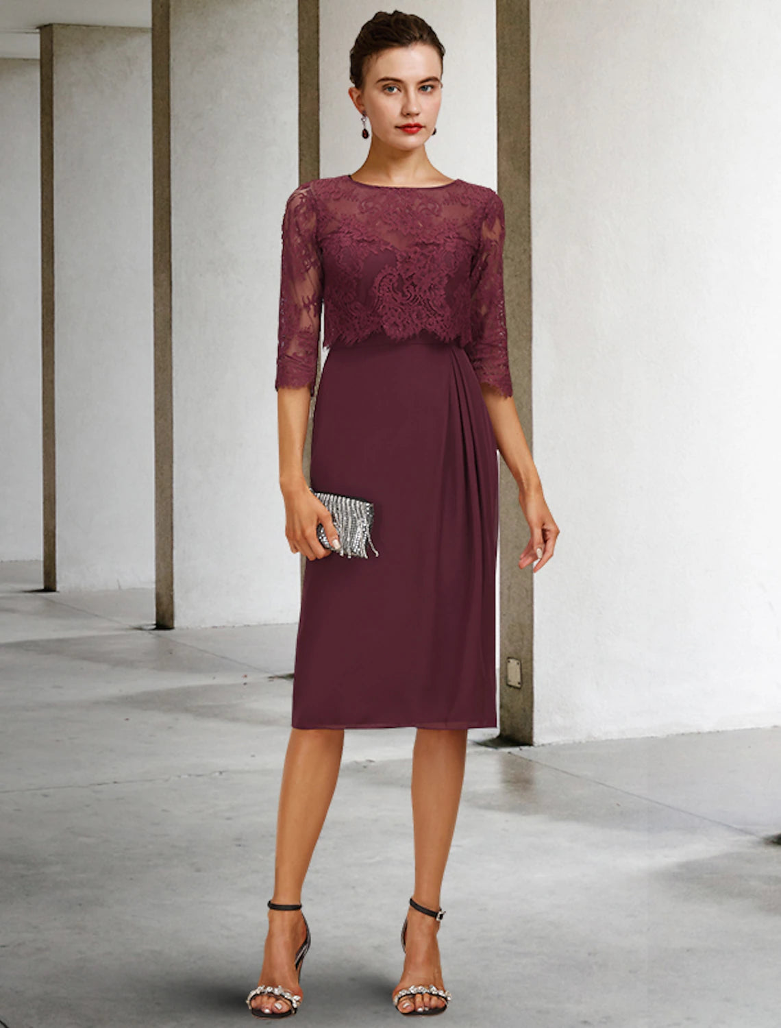 Elegant A-line mother of the bride dress with jewel neck and half sleeves, featuring chiffon lace and pleats.