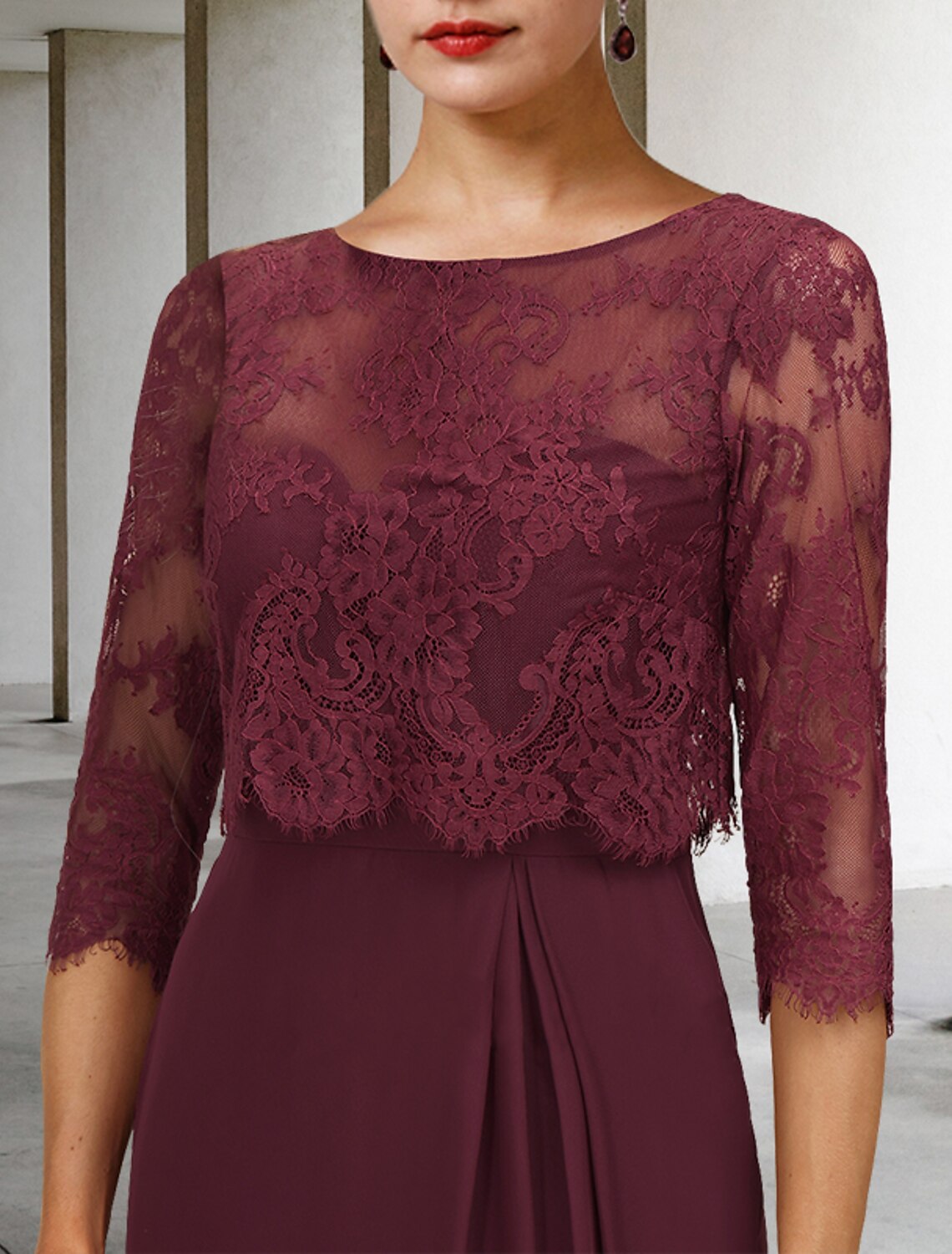 Back view of vintage chiffon lace dress, showcasing jewel neck and pleated A-line skirt.