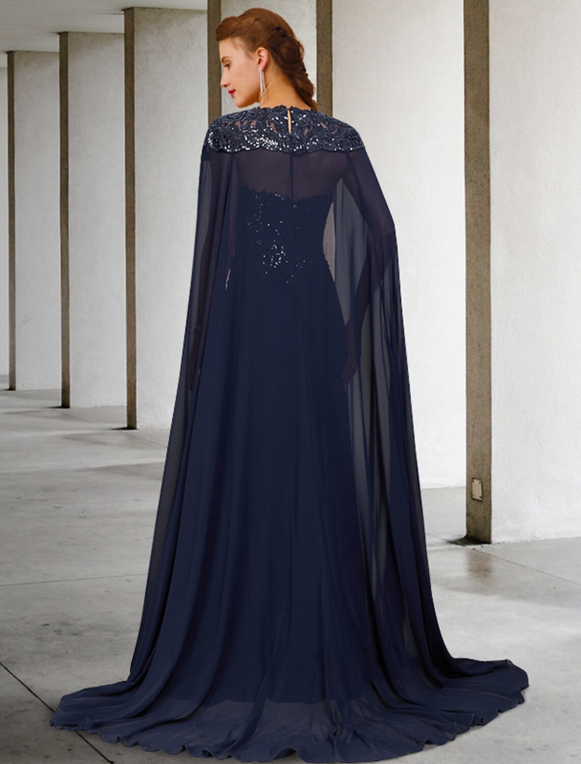 Close-up of the back of the two-piece A-line mother of the bride gown, showing lace and sequin details.