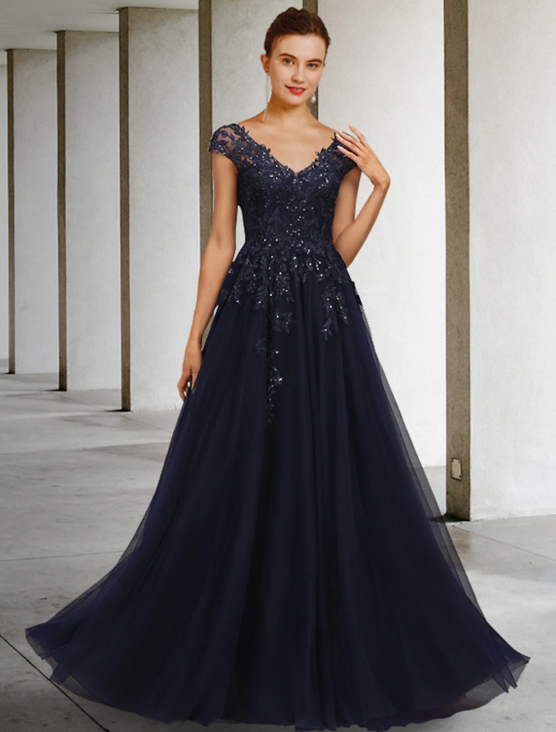 Elegant A-line mother of the bride dress with V-neck, cap sleeves, and sequin appliques.