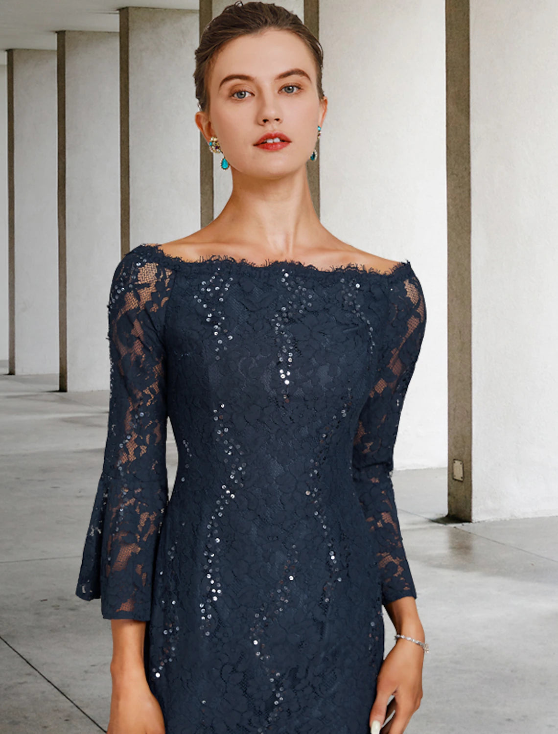 Side view of the Weitese sheath dress, highlighting lace sleeves and sequin details.
