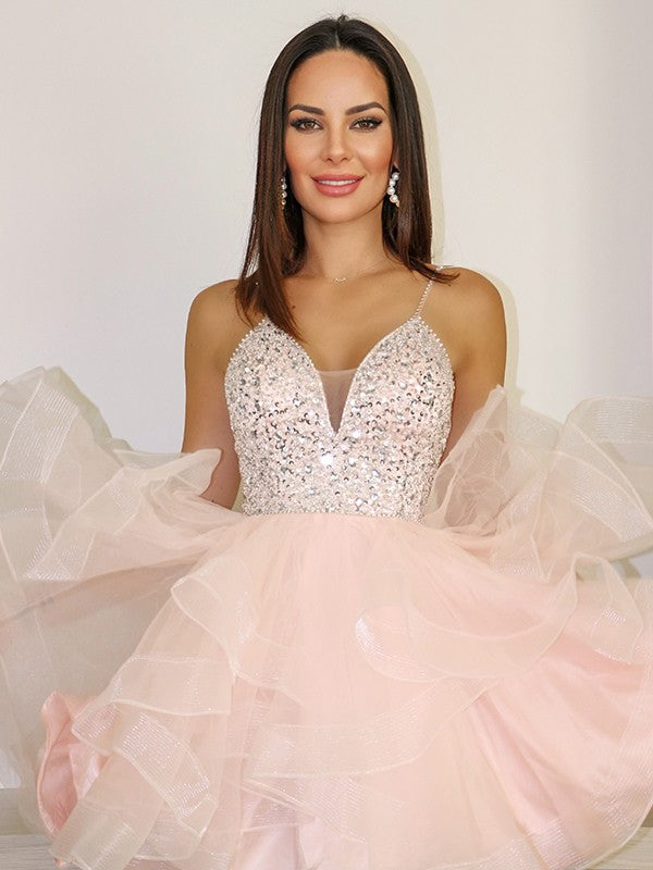 Back view of the light-colored Weitese short homecoming dress, highlighting the open back and A-line silhouette.