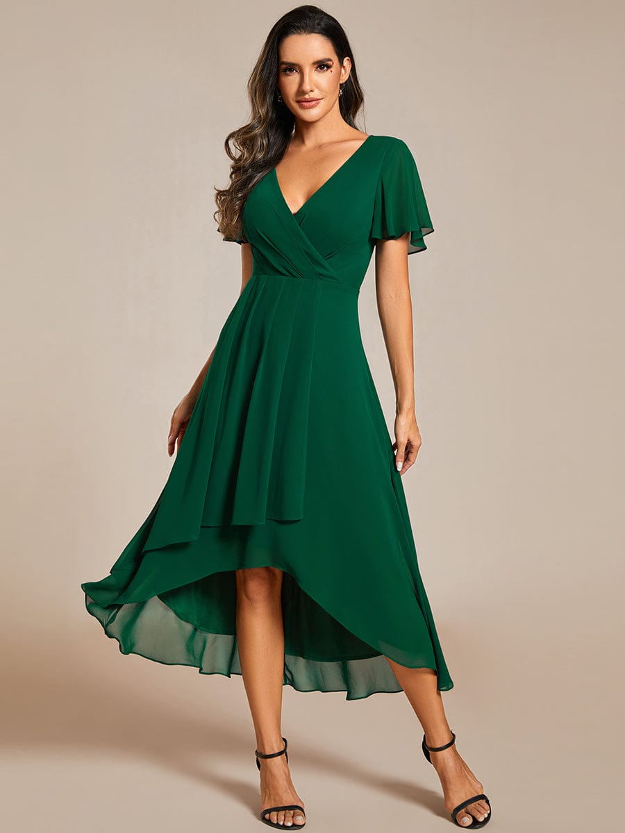 Full length view of Weitese V-neck pleated dress in dark green.