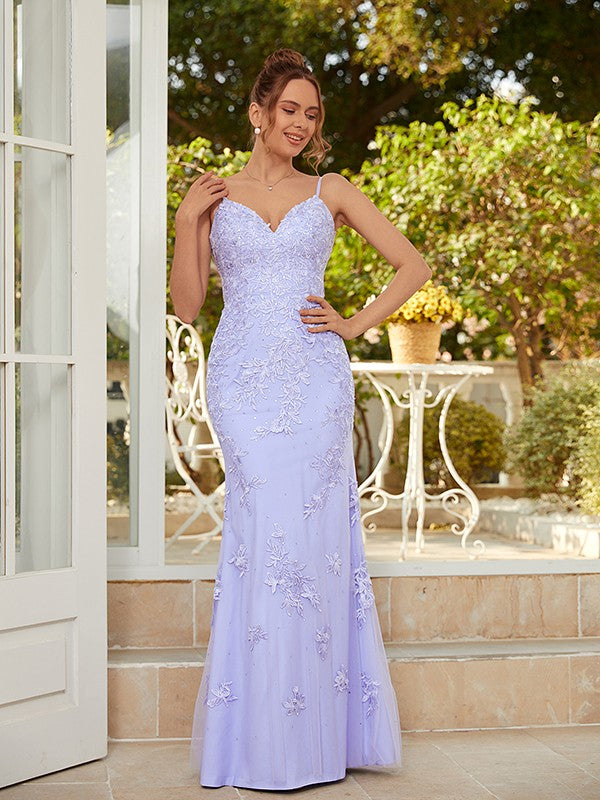 Back view of the light blue floor-length prom dress, showcasing the sheath column silhouette and train.