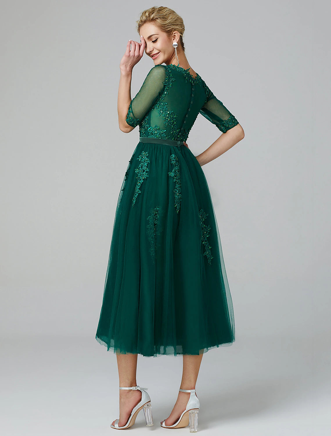 Close-up of the illusion neckline and sequin lace details on the dress.