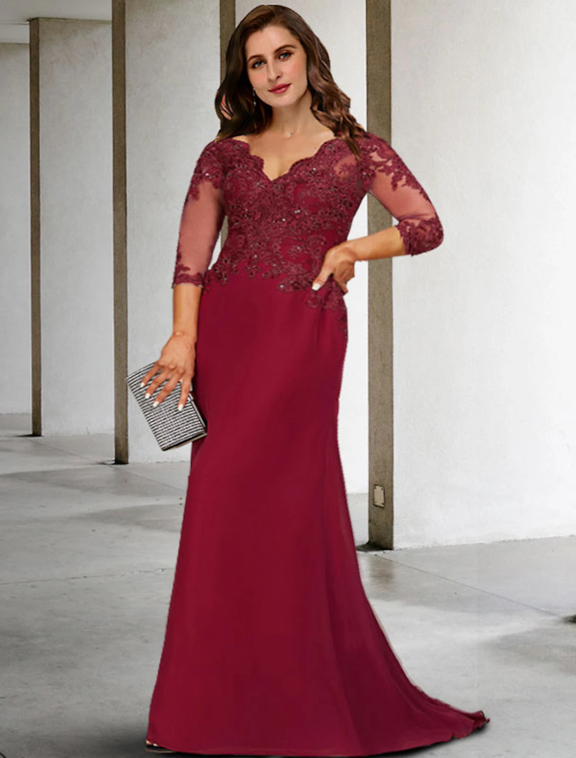 Elegant plus size A-line Mother of the Bride dress with V-neck and 3/4 sleeves.