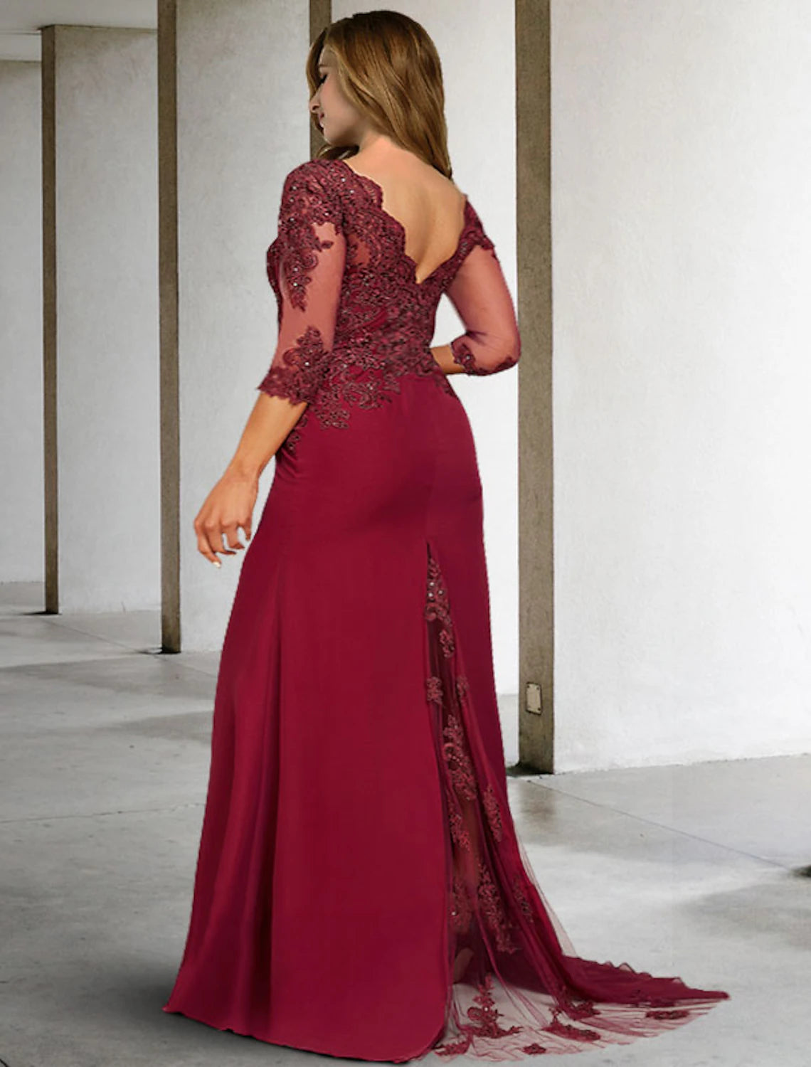Back view of a formal chiffon gown featuring a court train and sequin details.
