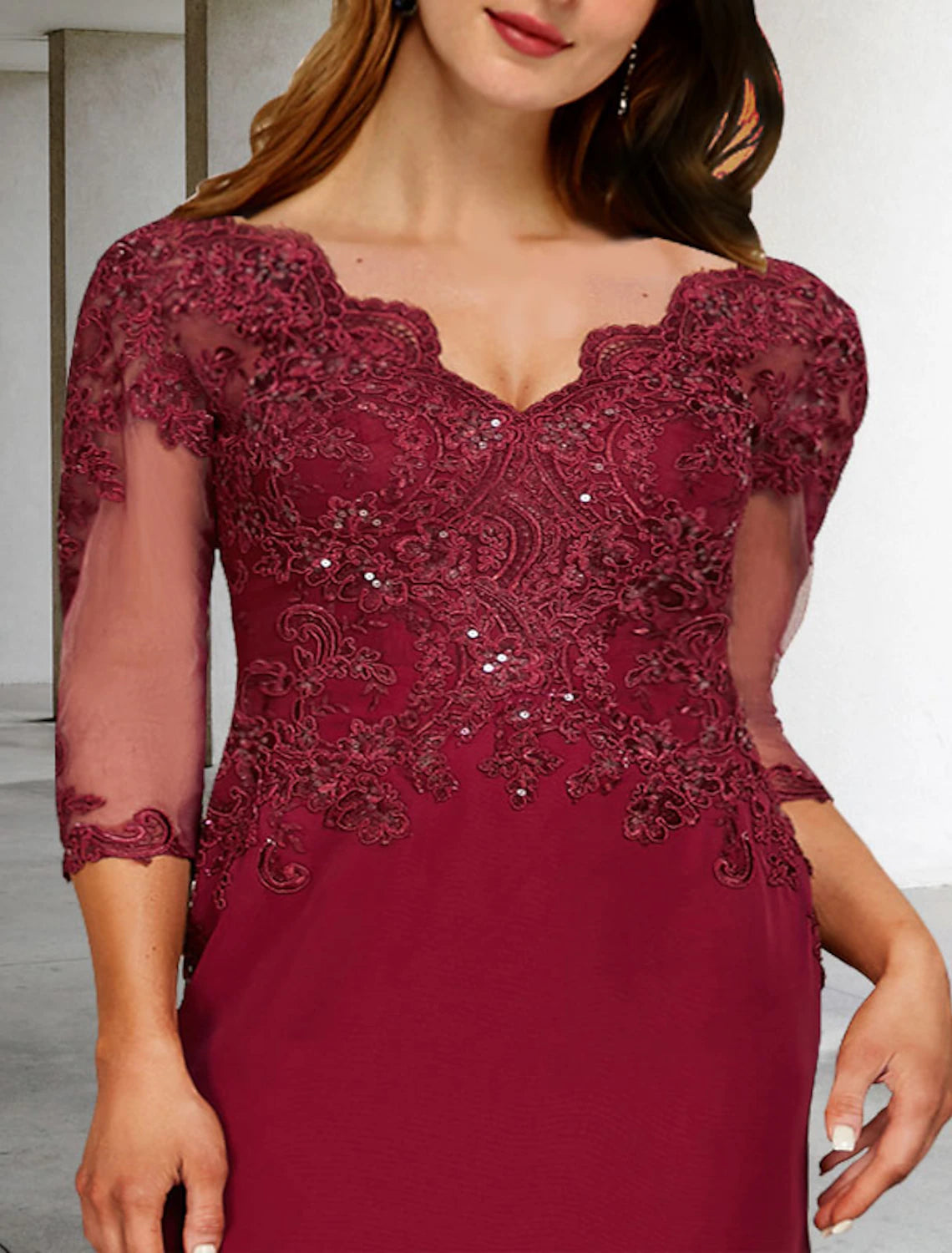 Close-up of the sequin slit applique on the elegant A-line dress.