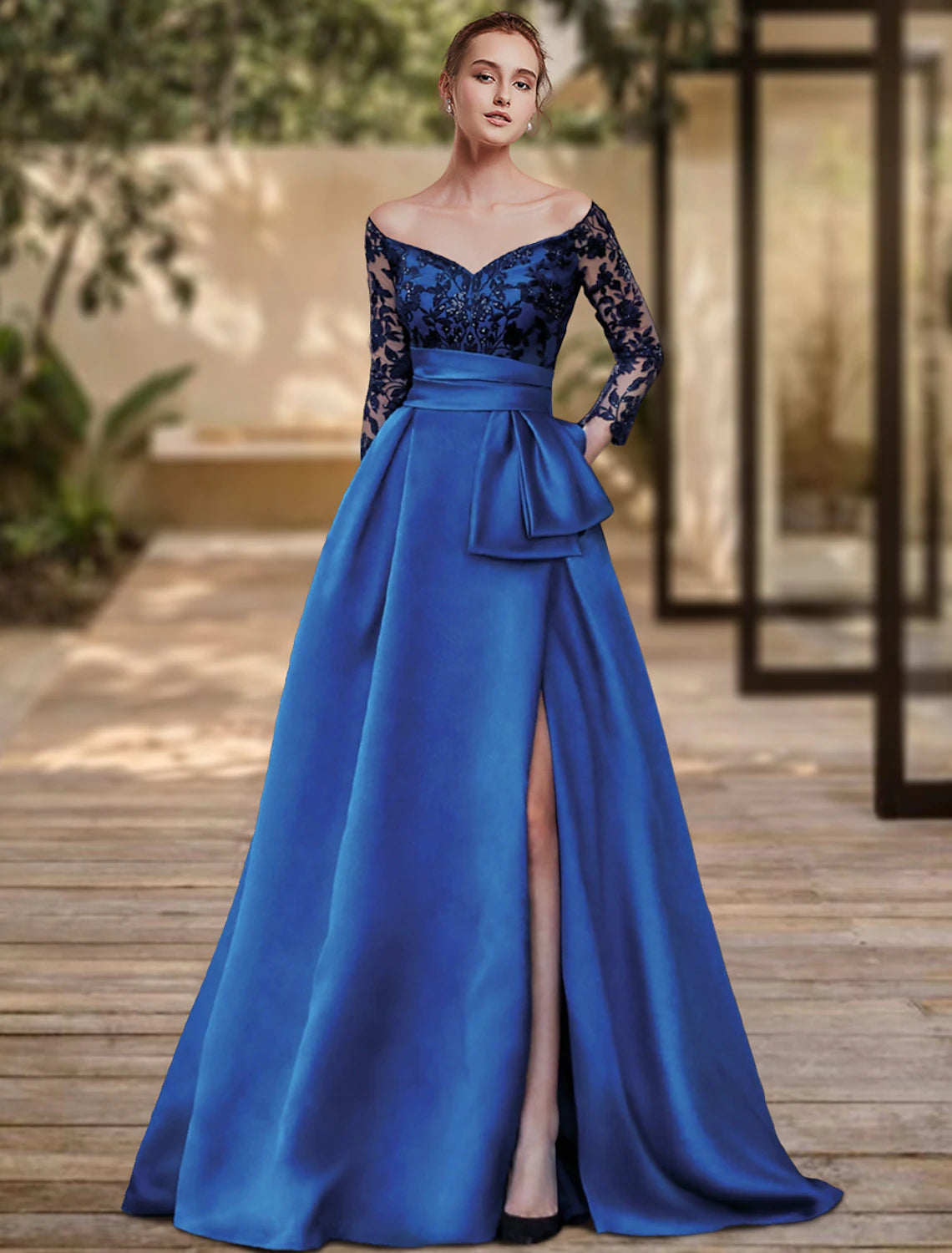 Elegant off-shoulder sheath evening gown with a high split and sequin embellishments.