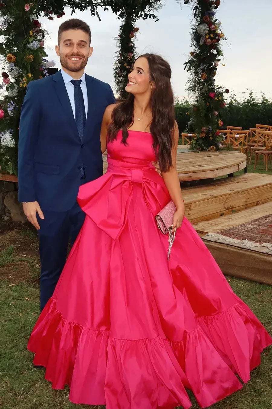 Glamorous Hot Pink Strapless Tiered Ruffled Gown With Oversized Bow