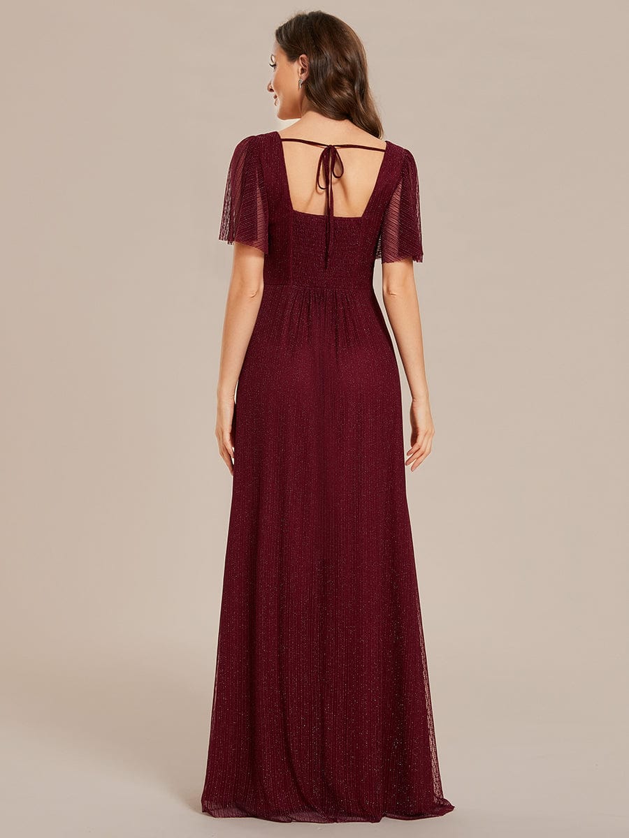 Side view of the glittery A-line bridesmaid dress, highlighting the high slit and shimmering fabric.