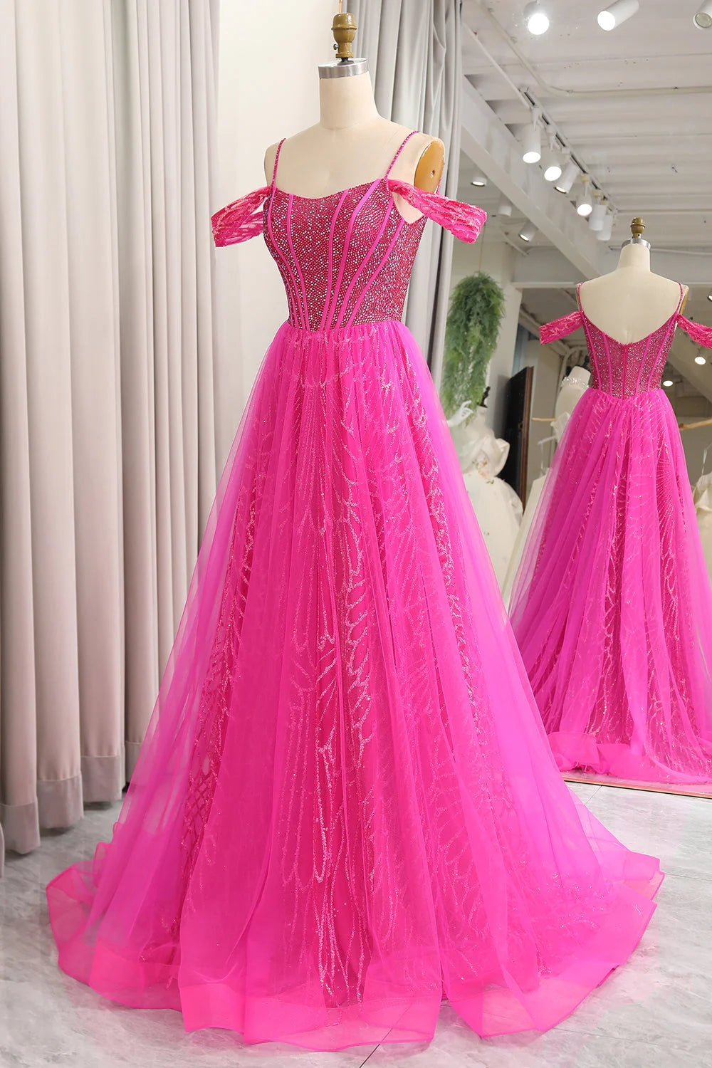 Robe de bal longue en tulle fuchsia à épaules dénudées et coupe trapèze