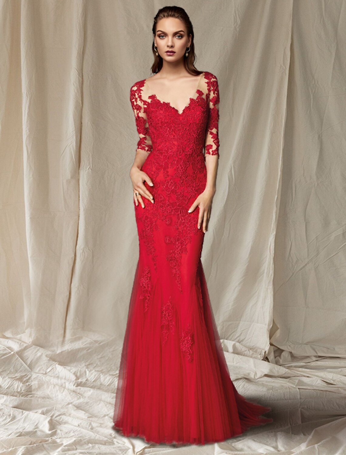 Elegant woman wearing a Weitese mermaid mother of the bride dress with V-neck, half sleeves, lace, and appliques.