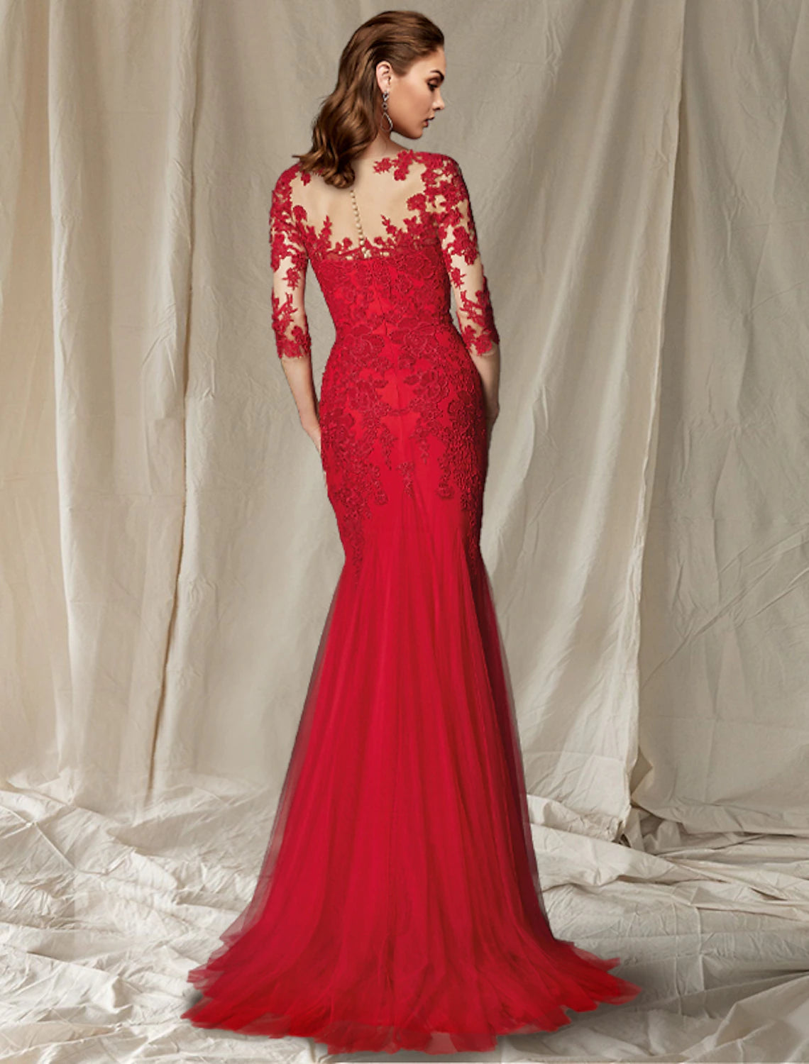 Back view of the Weitese mermaid mother of the bride dress, showcasing the sweep train and intricate lace details.