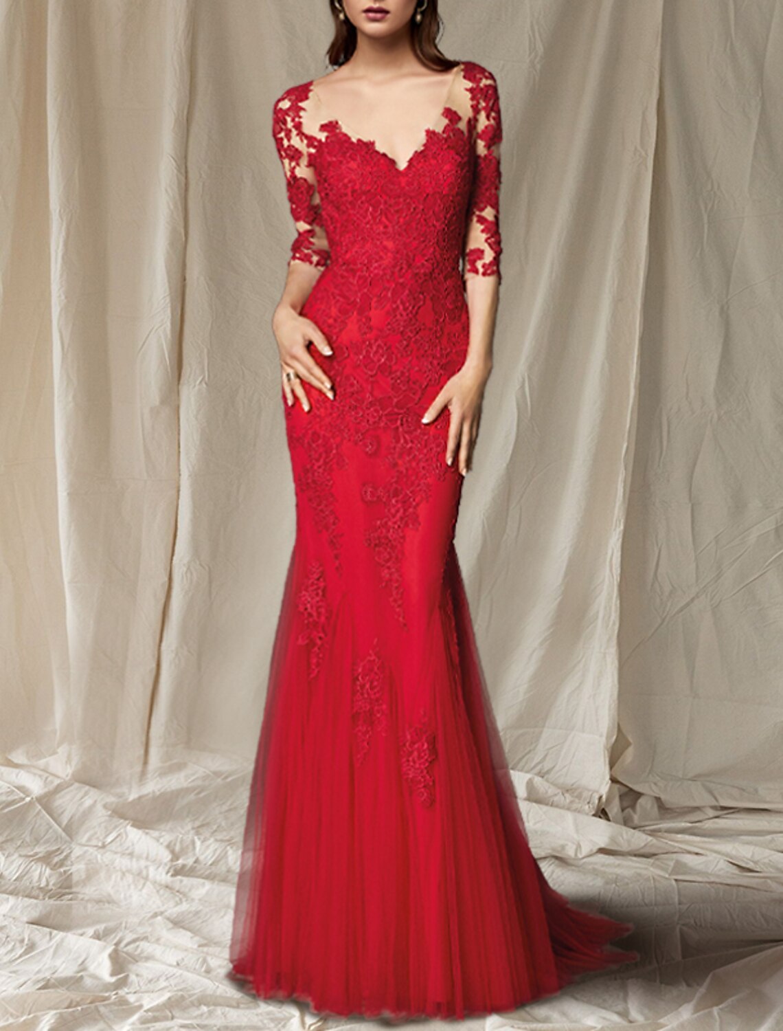 Close-up of the delicate lace and applique embellishments on the Weitese mother of the bride gown.