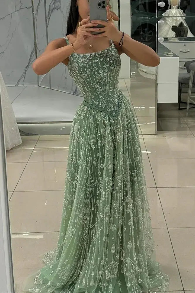 Spaghetti strap heavy beaded A-line gown