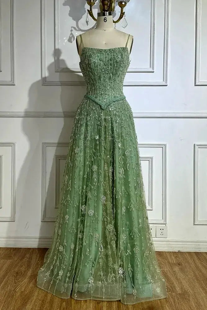 Spaghetti strap heavy beaded A-line gown