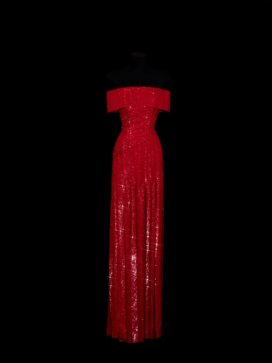 Model wearing a red sequin mermaid evening dress with an off-shoulder neckline.
