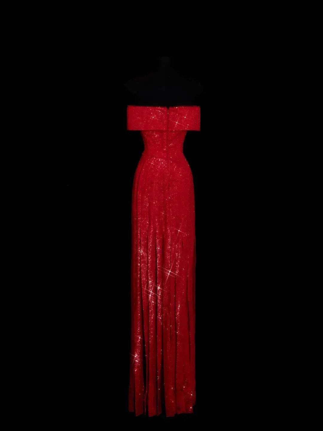 Side profile of the red sequin mermaid gown, highlighting its fitted silhouette.