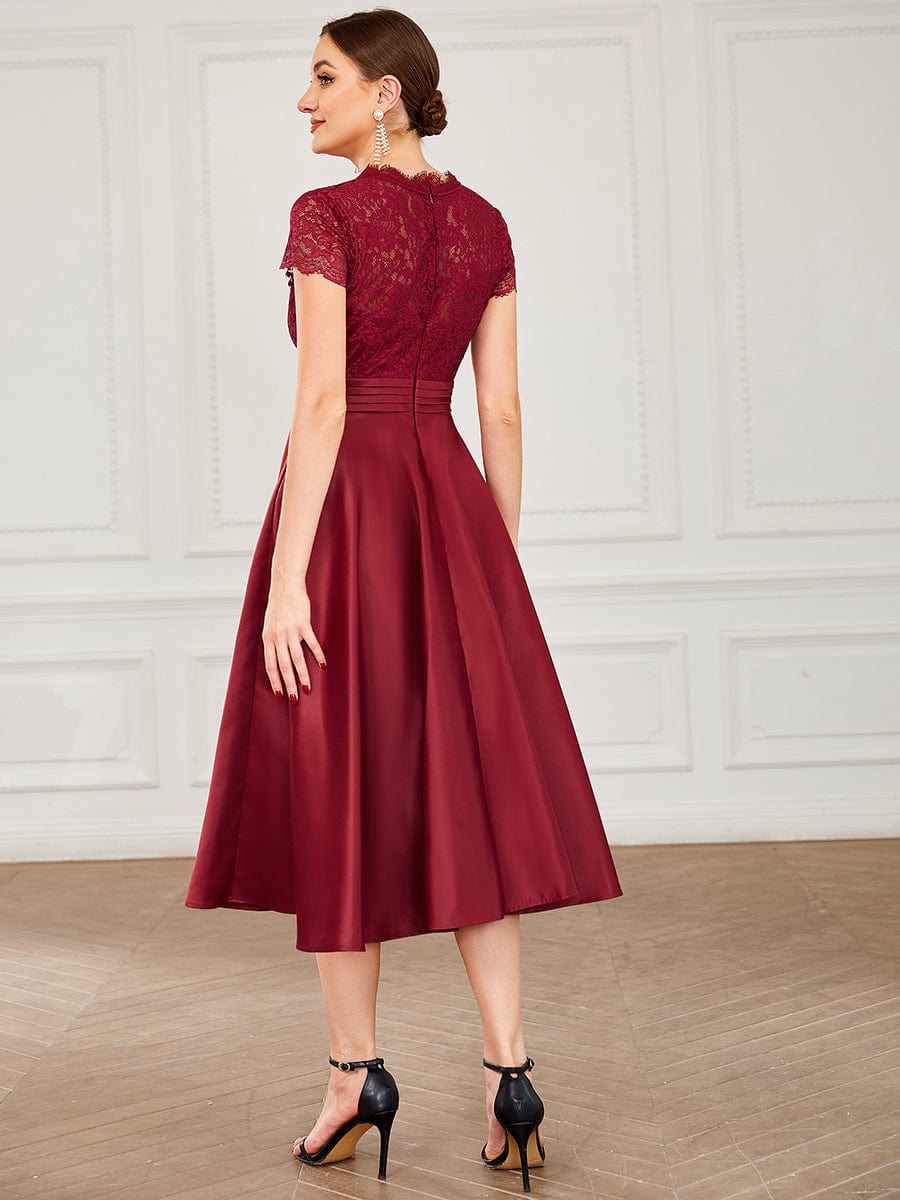 Side view of a model in a burgundy Weitese V-neck lace dress, showcasing the bodice detail.