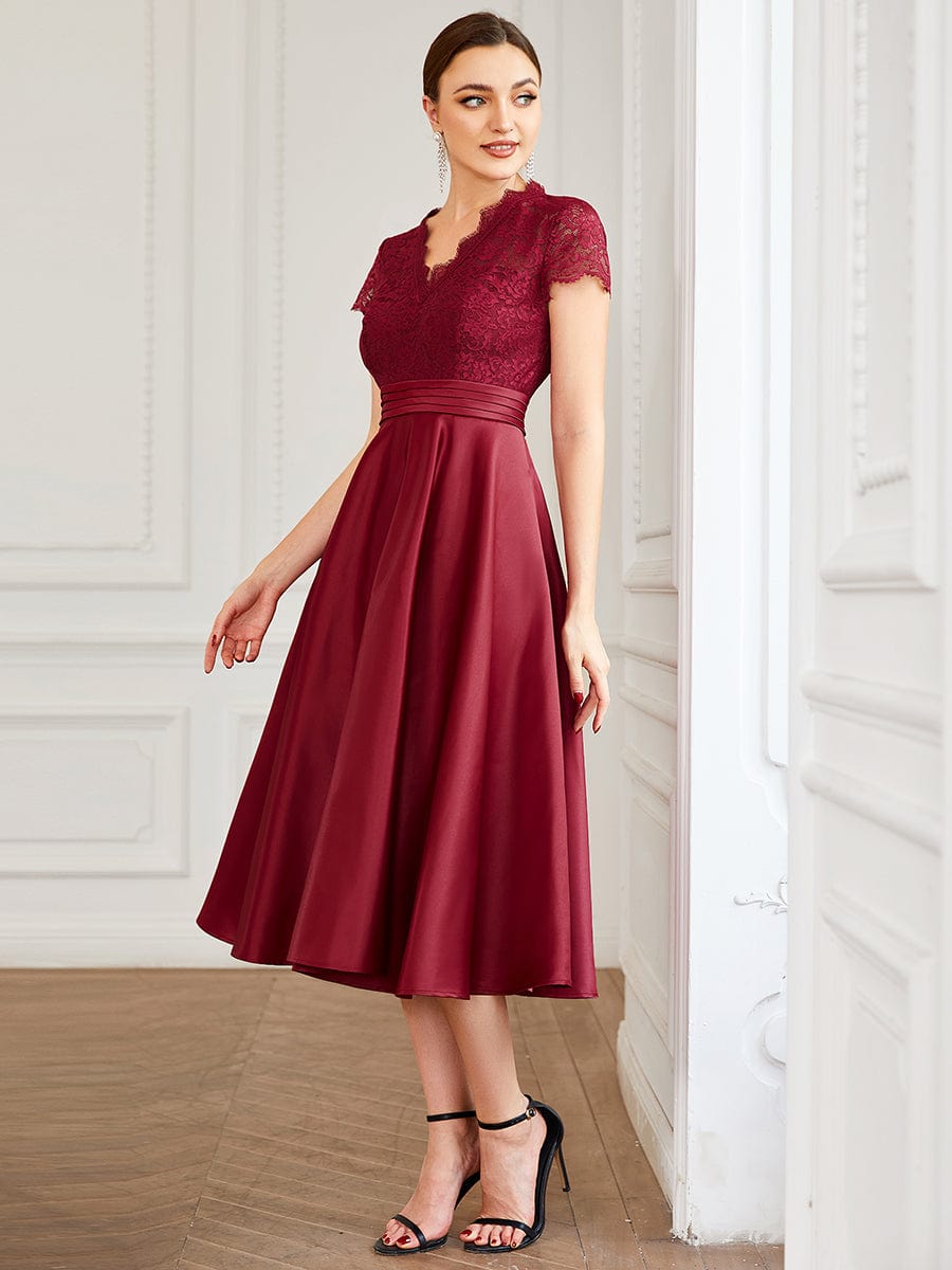 Close-up of the lace bodice and V-neckline on the burgundy Weitese dress.