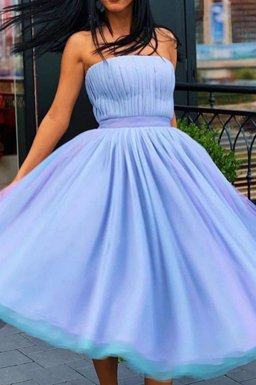 Back view of a romantic pleated A-line short homecoming dress.