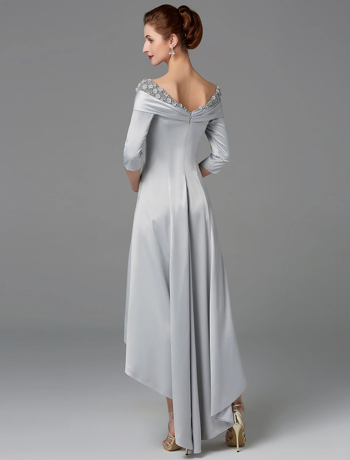 Side view of the sparkling A-line off-shoulder gown, highlighting the high-low asymmetrical hem.