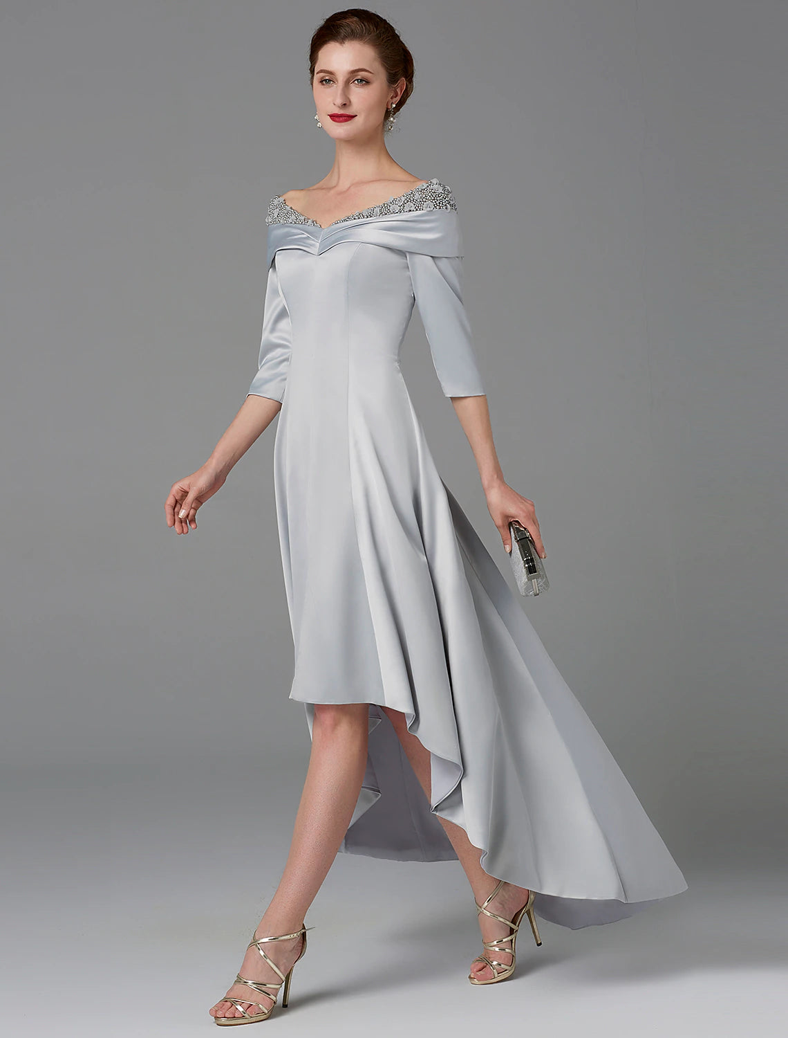 Back view of the elegant mother of the bride dress, showing lace details and train.