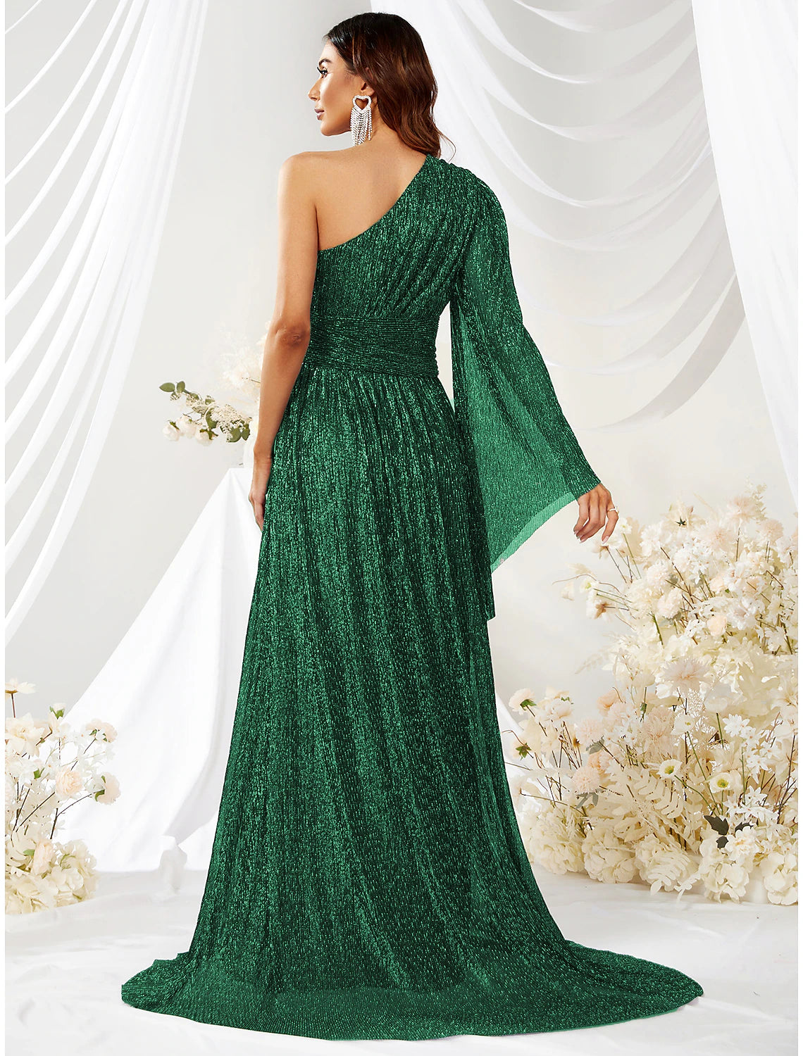 Back view of the sparkling A-line one-shoulder long-sleeve dress, showcasing the elegant sweep train.