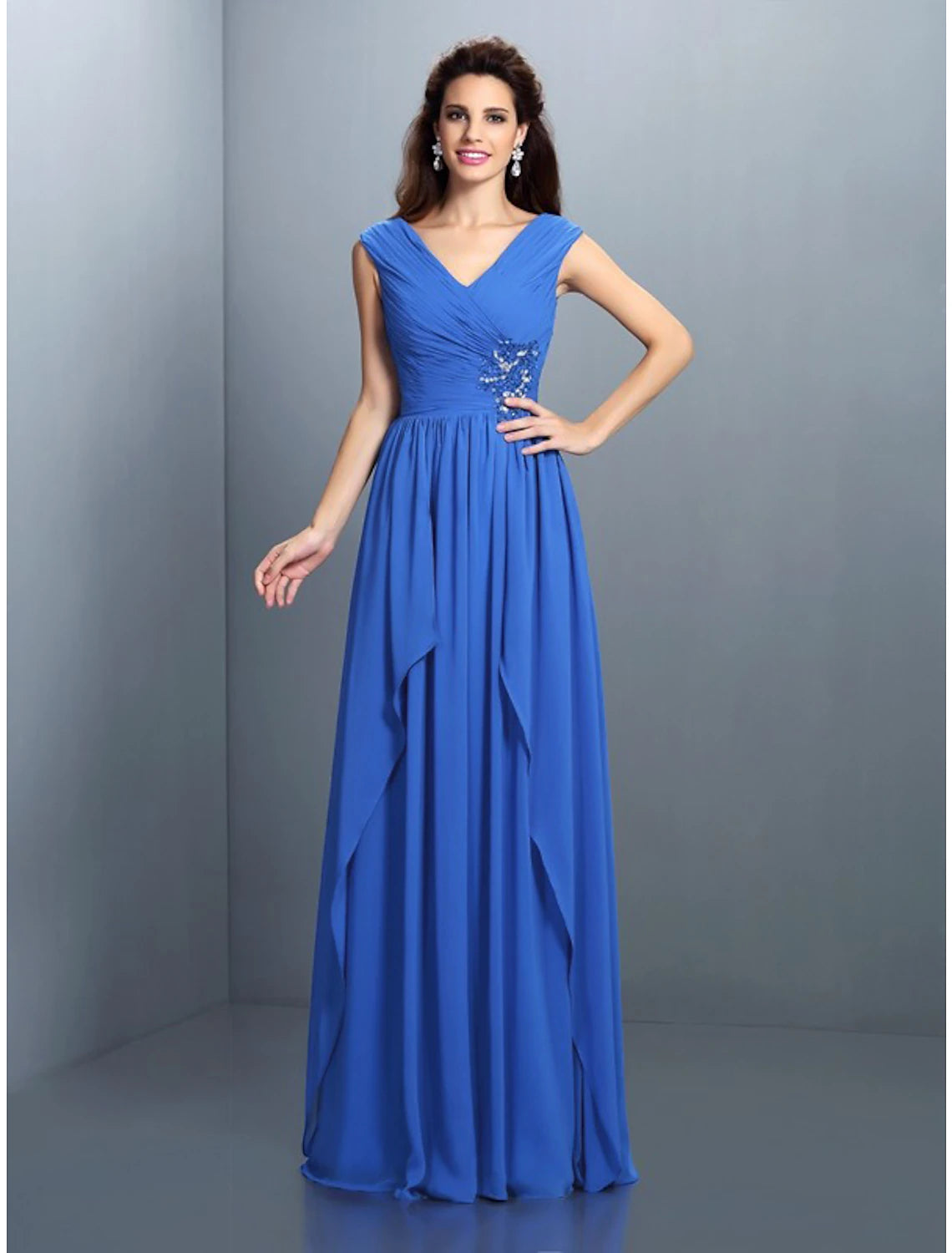 Model wearing a sparkling A-Line V-neck floor-length evening gown with rhinestone and sequin details.
