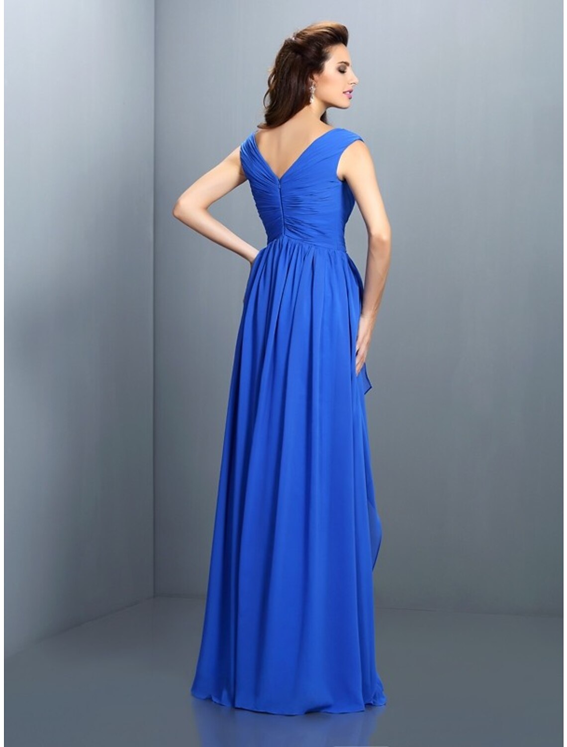 Back view of the A-Line V-neck evening gown, showcasing the floor-length skirt and shimmering embellishments.
