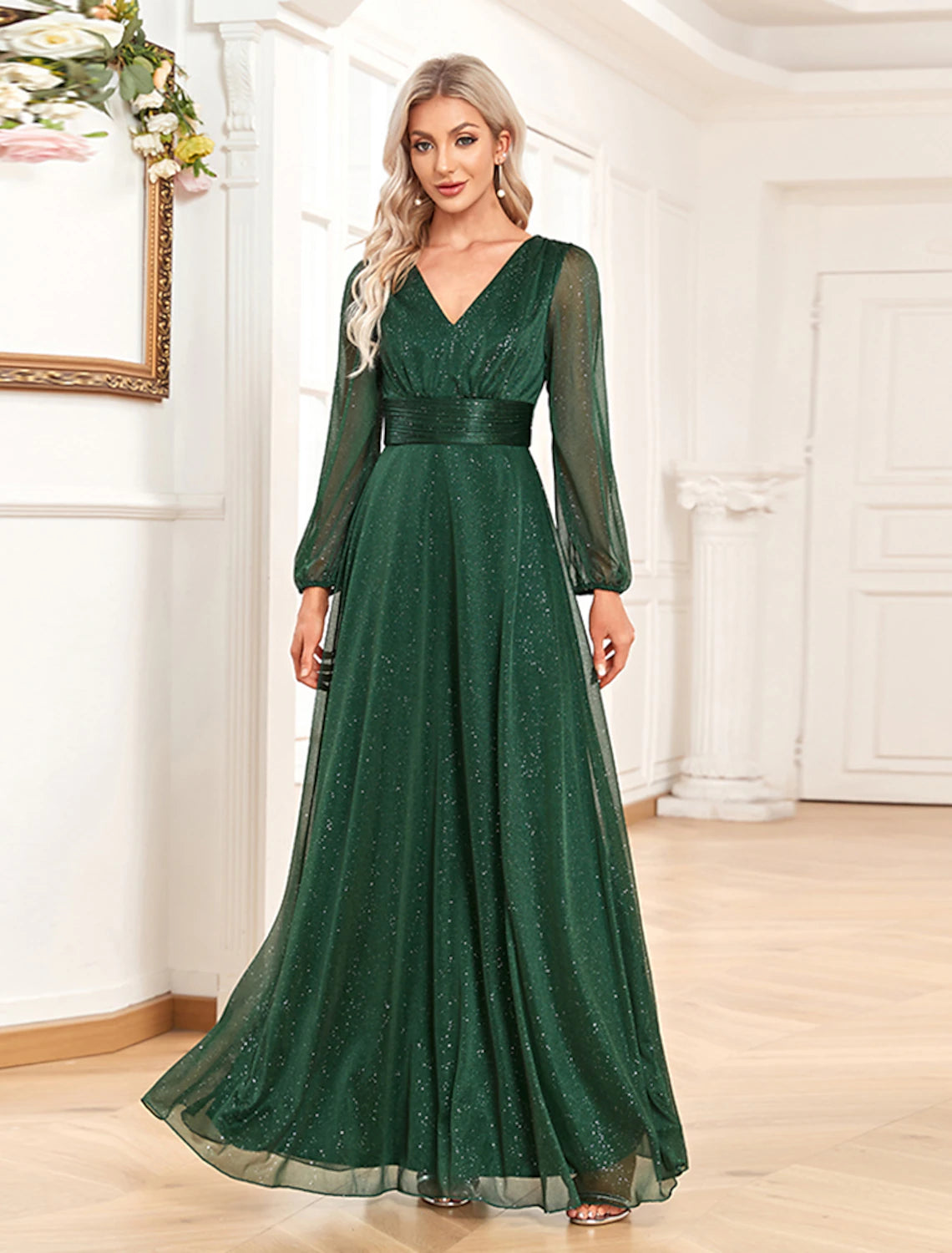 Model wearing a sparkling A-line V-neck long sleeve sequin chiffon evening gown.