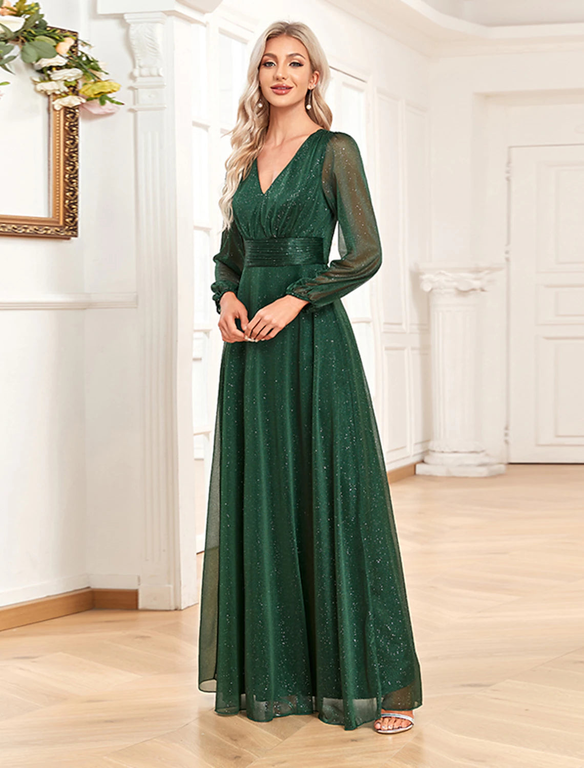Detailed view of the sparkling sequin pattern on the chiffon fabric of the gown.