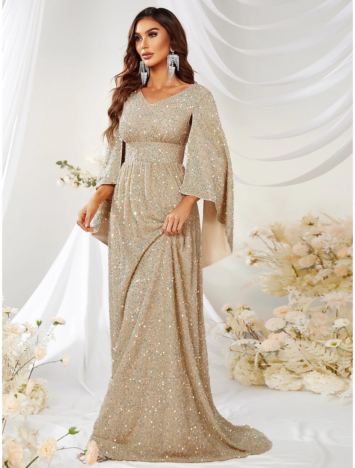 Full-length view of the sparkling A-line V-neck long-sleeve sequin evening gown.
