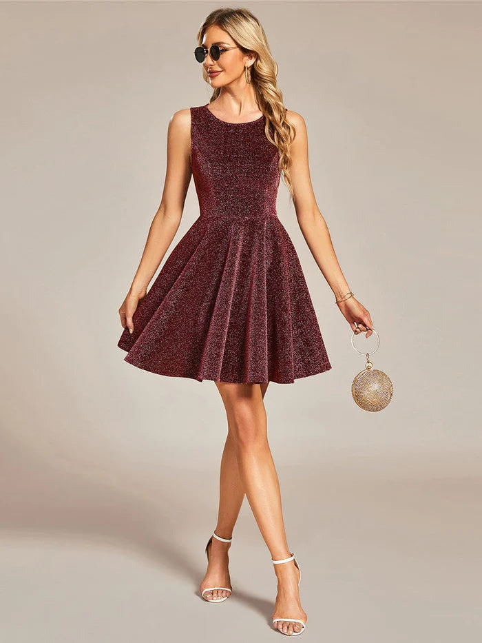 Full length view of a model showcasing the short glitter party dress.