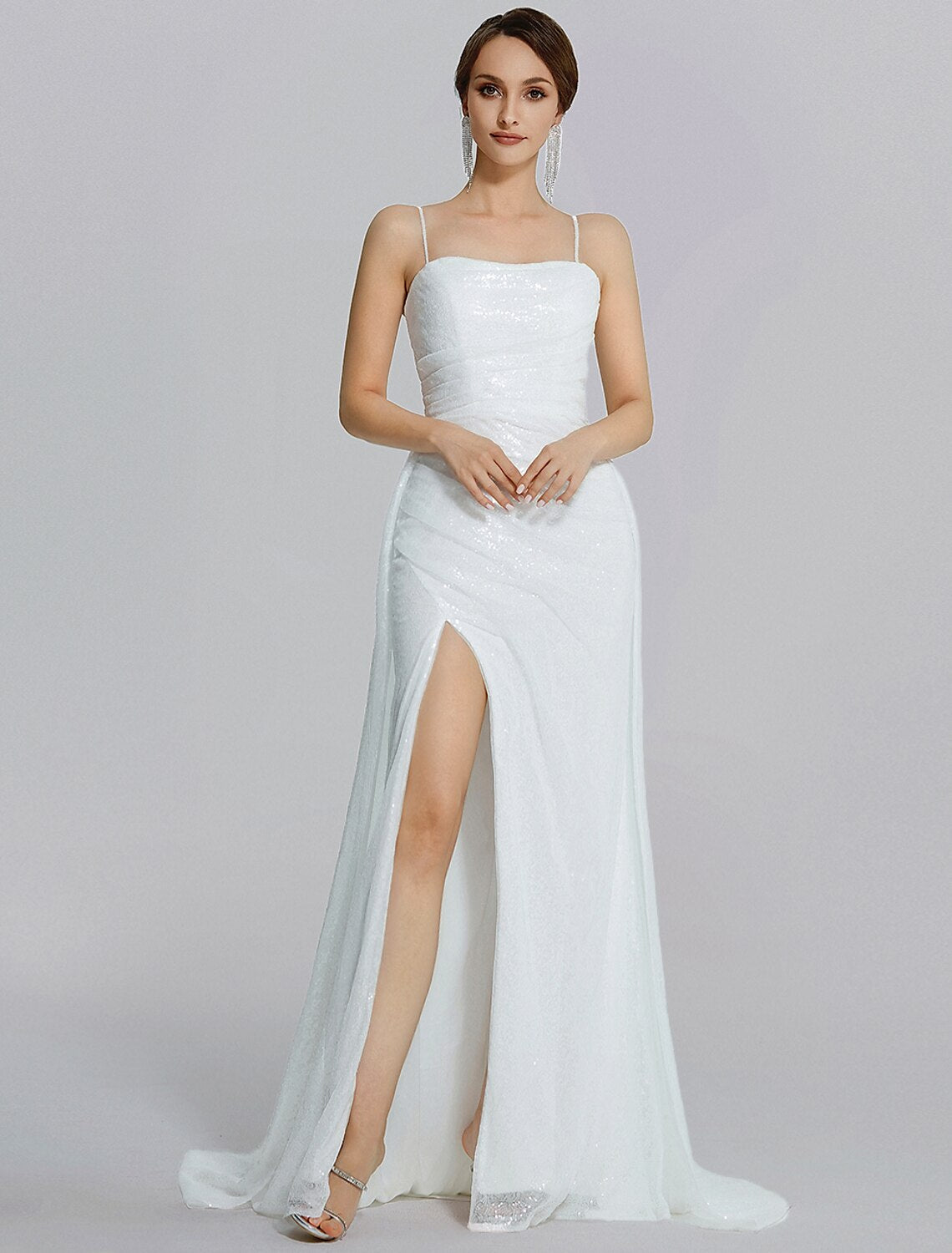 Close-up of the sequined fabric and cowl neck detail on the sparkling prom dress.