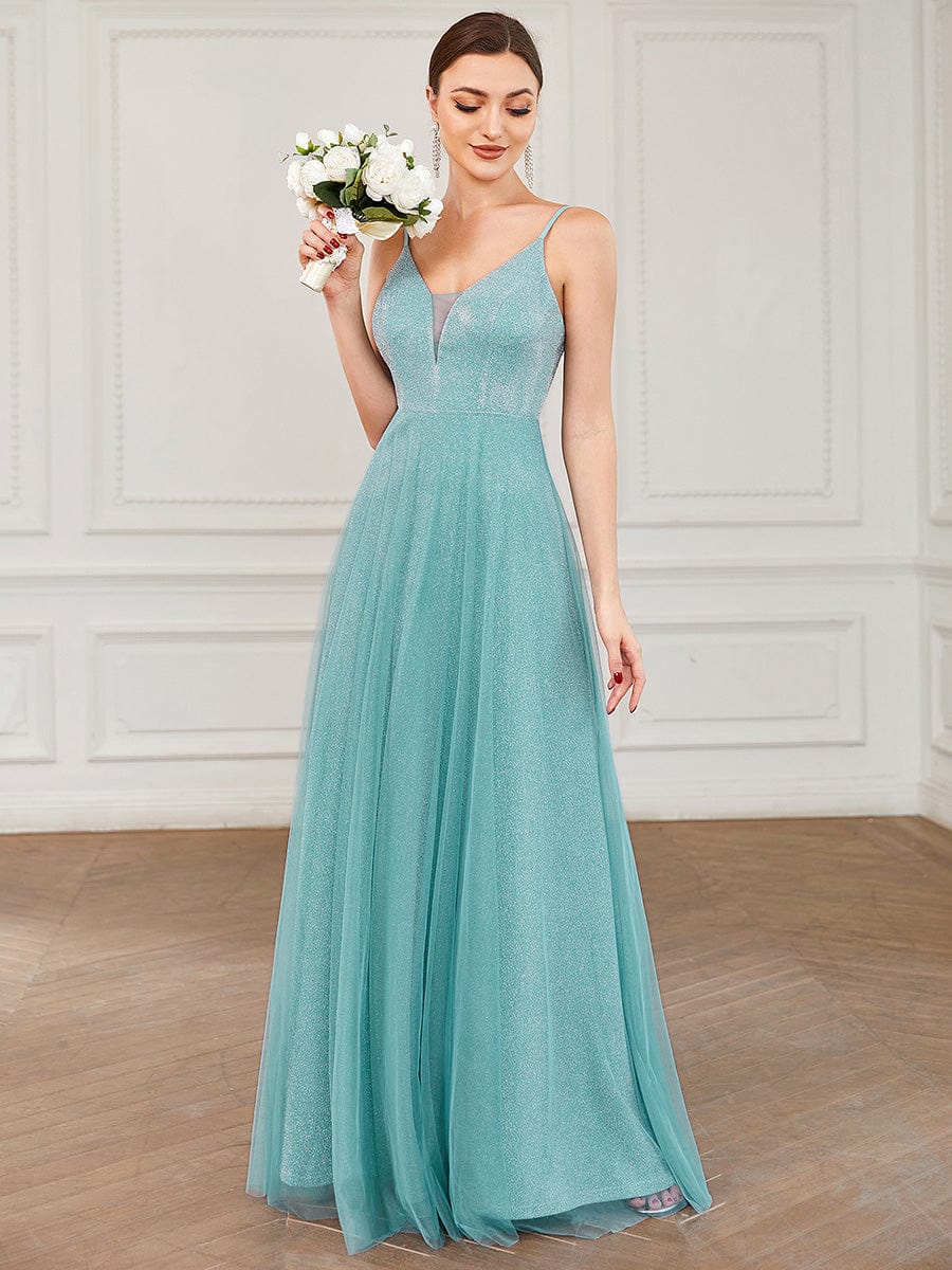 Model wearing a sparkly A-line V-neck bridesmaid dress.